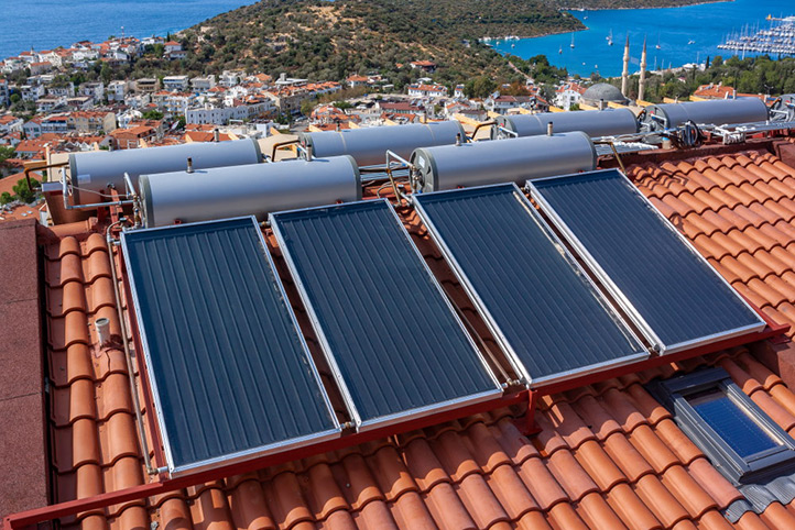 solar-water-heater-installed-tile-roof-house-eco-heating-water-large-water-tanks-horizontal-photo_4112